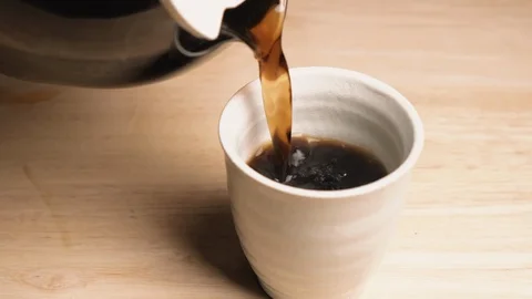 Black Coffee Pouring Into A Cup Stock Footage 127305904