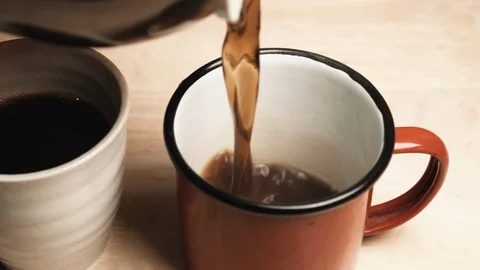 Black Coffee Pouring Into A Cup Stock Footage 127306025