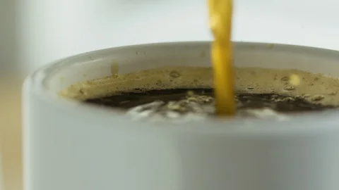 Black coffee pouring into a mug. Stock Footage 128201124