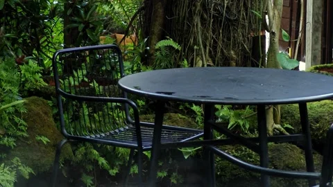 Black coffee table in the garden. Stock Footage 305043260
