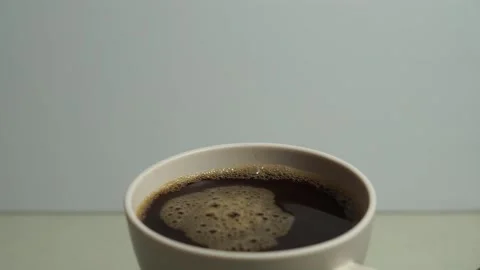 Black coffee in a white cup Stock Footage 256983377