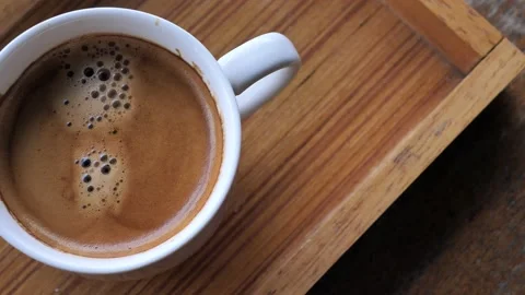 Black coffee with white cup on old wooden table, Stock Footage 140748397