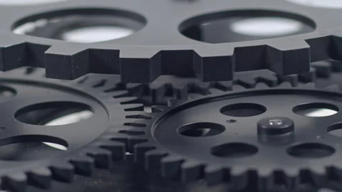 Black Cogs Spin Infinitely in Harmony Stock Footage 302940786