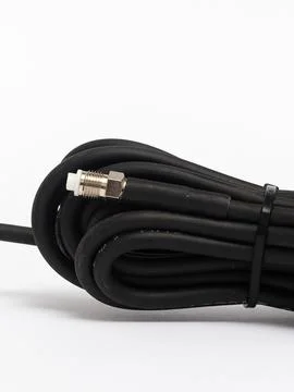 Black coiled antenna cable close up Stock Photos