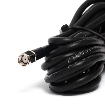 Black coiled cable with gold connector close up variant Stock Photos