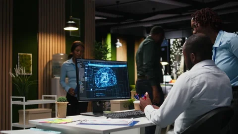 Black colleagues team using AI analytics platform for monthly data reports Stock Footage 318563305