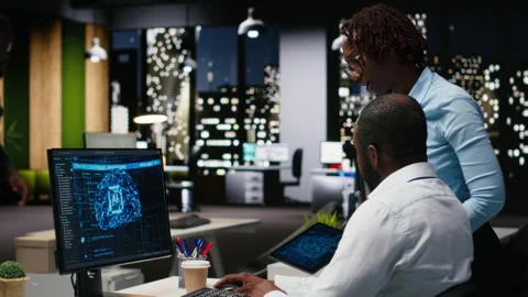 Black colleagues team using AI analytics platform for monthly data reports Stock Footage 318563600