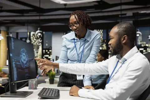 Black colleagues team using AI analytics platform for monthly data reports Fotos Stock