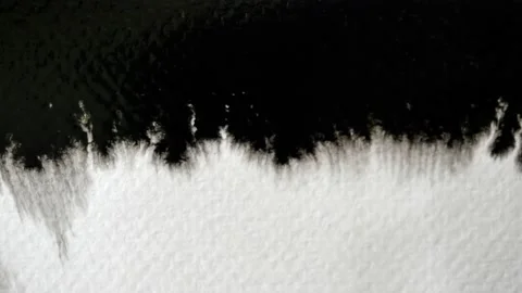 Black color flowing and spreading on the white background Stock-Footage 145677483