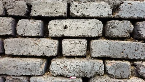 Black colored abstract brick  wall texture background with block design Stock Photos