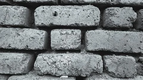 Black colored abstract brick  wall texture background with block design Stock Photos