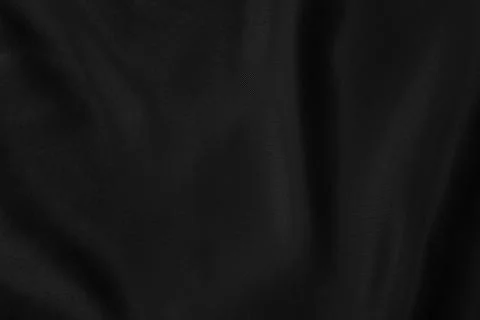 Black colored Background of soft draped fabric Stock Photos