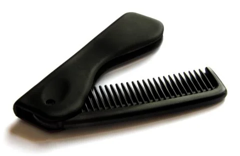 A black comb on isolated background Stock Photos
