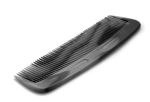 Black comb isolated on a white background. Close up Stock Photos