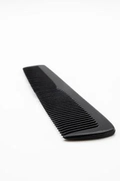 Black comb on a white background Stock Photos