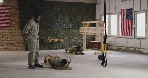 Black commander instructing soldier during training Stock Footage 154483678