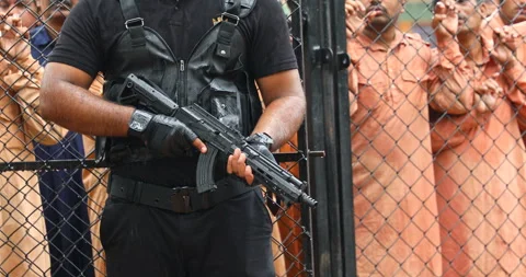 Black Commando Hand with gun Stock Footage 283524074