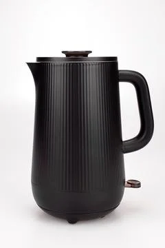 Black compact teapot close-up Stock Photos