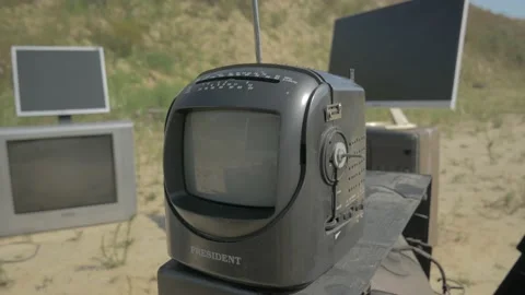 Black compact tv at the shooting range Stock Footage 195095434