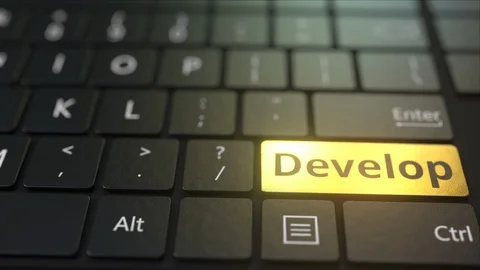 Black computer keyboard and gold develop key. Conceptual 3D animation Stock Footage 116478230