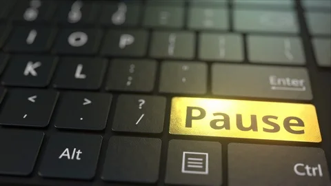 Black computer keyboard and gold pause key. Conceptual 3D animation Stock Footage 116813532