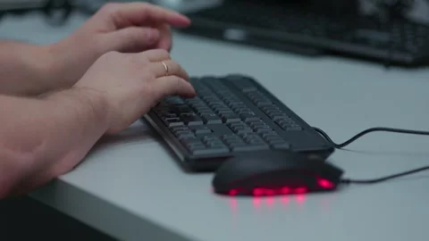 A black computer keyboard and mouse are on a table Stock Footage 335560807