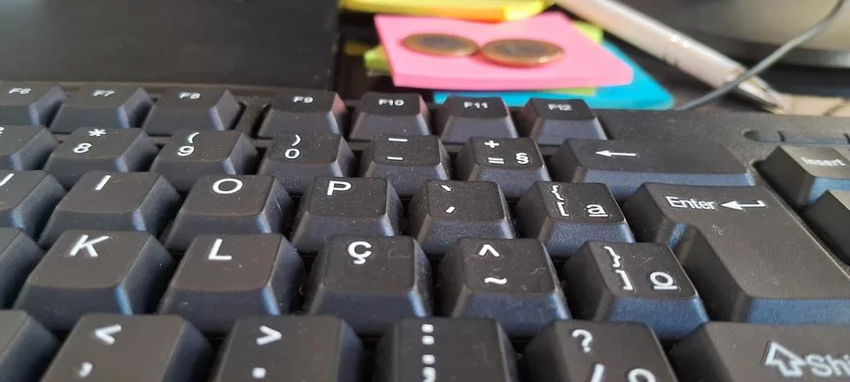 Black computer keyboard close up. Office desk workspace with sticky notes and Foto stock