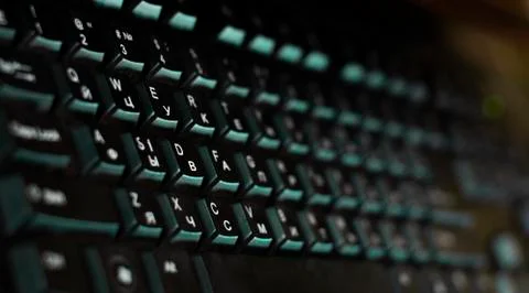 Black computer keyboard in the foreground Stock Photos