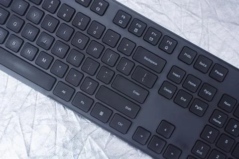 Black computer keyboard with keys on a desk surface. Modern workspace, offi.. 写真素材