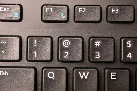 Black Computer Keyboard Macro Shot Highlighting 2 and At Symbol Key with So.. Stock Photos