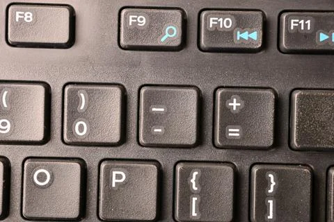 Black Computer Keyboard Macro Shot Highlighting Minus Key with Soft Blurred.. Stockfoto's