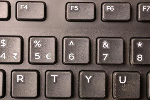 Black Computer Keyboard Macro Shot Highlighting 6 and Caret Key with Soft B.. Stock-Fotos
