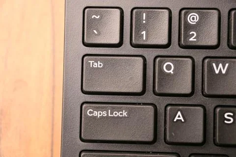 Black Computer Keyboard Macro Shot Highlighting Tab Key with Soft Blurred B.. Foto stock