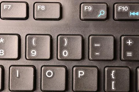Black Computer Keyboard Macro Shot Highlighting 0 and Right Parenthesis Key.. Stock-Fotos