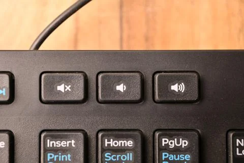 Black Computer Keyboard Macro Shot Highlighting Decrease Volume Key with So.. Stock Photos