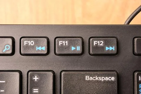 Black Computer Keyboard Macro Shot Highlighting F11 Key with Soft Blurred B.. Foto stock