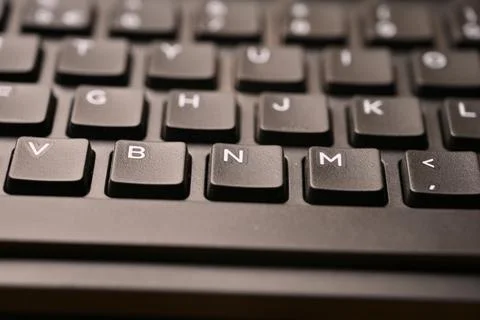 Black Computer Keyboard Macro Shot Highlighting N Key with Soft Blurred Bac.. Foto stock