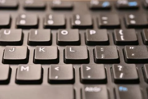Black Computer Keyboard Macro Shot Highlighting L Key with Angled Top View .. 스톡 사진