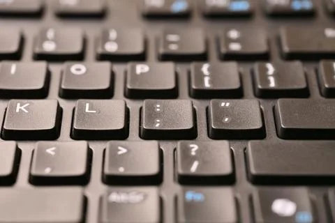 Black Computer Keyboard Macro Shot Highlighting Semicolon and Colon Key wit.. Stock Photos