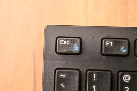 Black Computer Keyboard Macro Shot Highlighting Esc Key with Soft Blurred B.. Stock-Fotos
