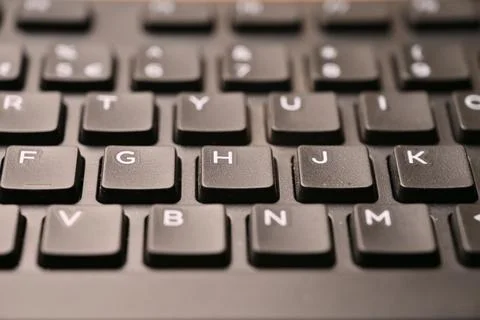 Black Computer Keyboard Macro Shot Highlighting H Key with Angled Top View .. 스톡 사진