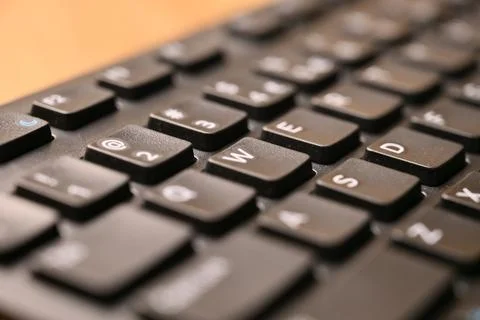 Black Computer Keyboard Macro Shot Highlighting W Key with Soft Blurred Bac.. Foto stock