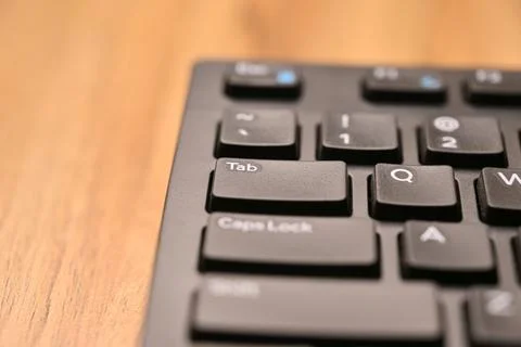 Black Computer Keyboard Macro Shot Highlighting Tab Key with Angled Top Vie.. Foto stock