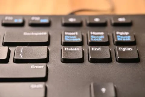 Black Computer Keyboard Macro Shot Highlighting Delete Key with Angled Top .. Stock Photos