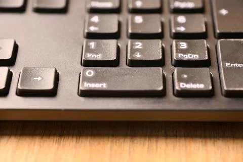 Black Computer Keyboard Macro Shot Highlighting 0 and Insert Keys on Numeri.. 스톡 사진