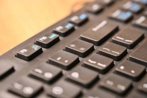 Black Computer Keyboard Macro Shot Highlighting Equals and Plus Key with So.. Stock-Fotos