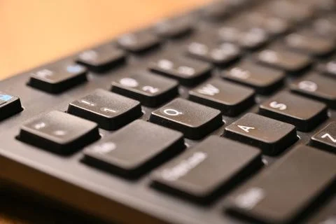Black Computer Keyboard Macro Shot Highlighting Q Key with Soft Blurred Bac.. 写真素材
