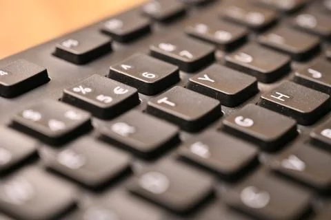 Black Computer Keyboard Macro Shot Highlighting Y Key with Soft Blurred Bac.. Foto stock