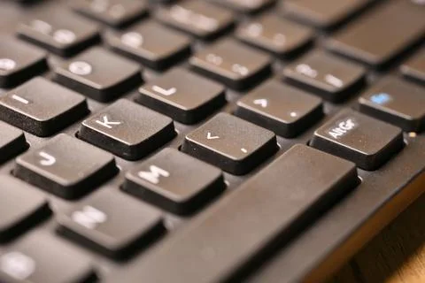 Black Computer Keyboard Macro Shot Highlighting Comma and Less Than Key wit.. Stock Photos