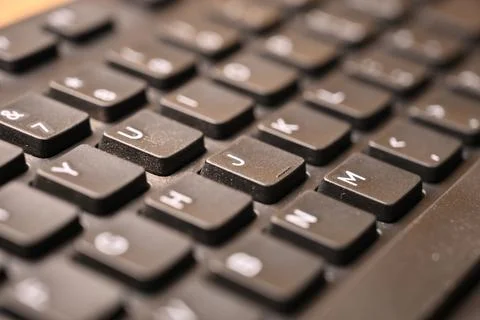 Black Computer Keyboard Macro Shot Highlighting J Key with Soft Blurred Bac.. Foto stock
